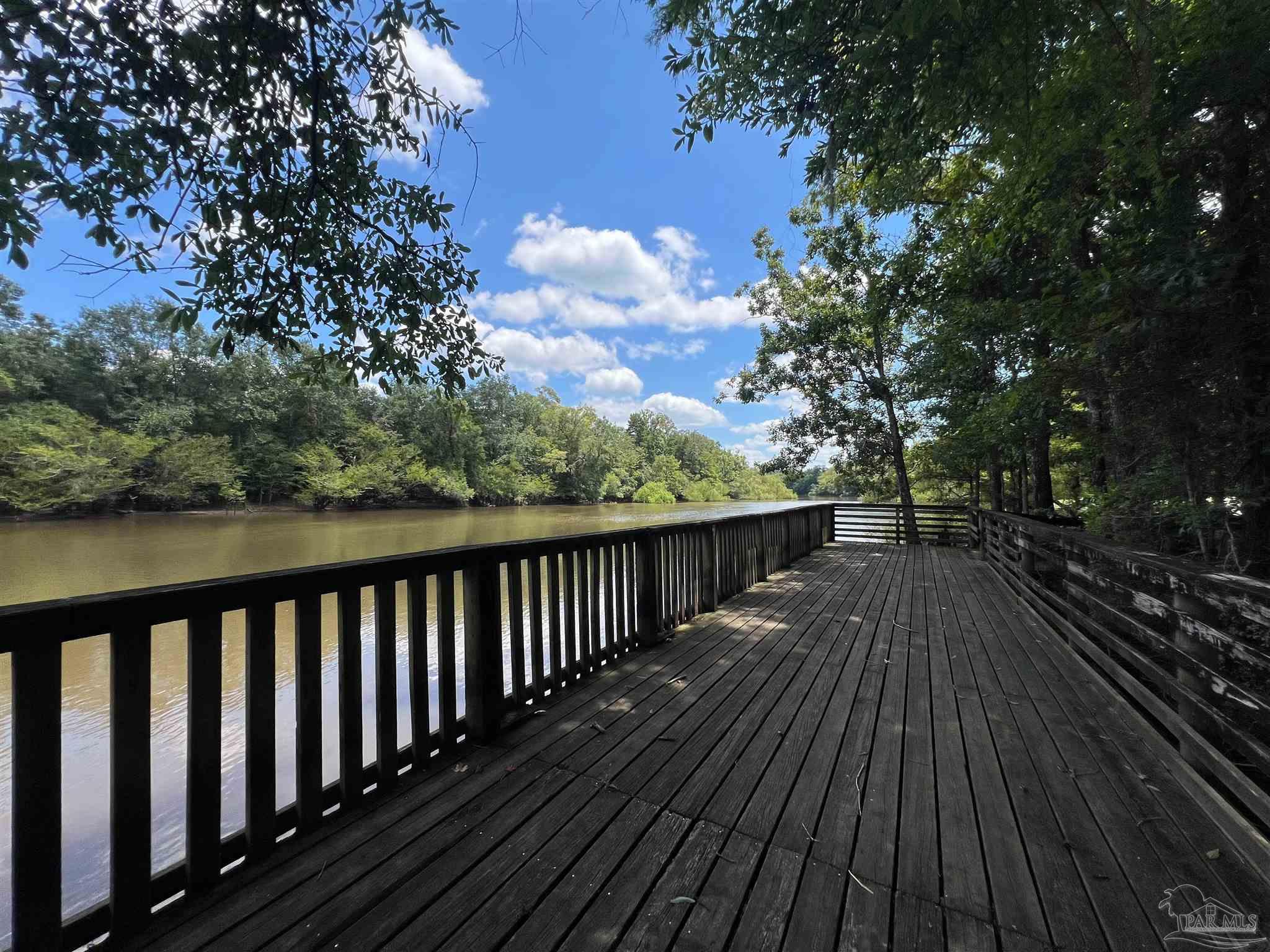 1100 McKinnonville Road Molino, FL 32577 - Photo 10 of 14 a view of balcony with wooden floor and fence
