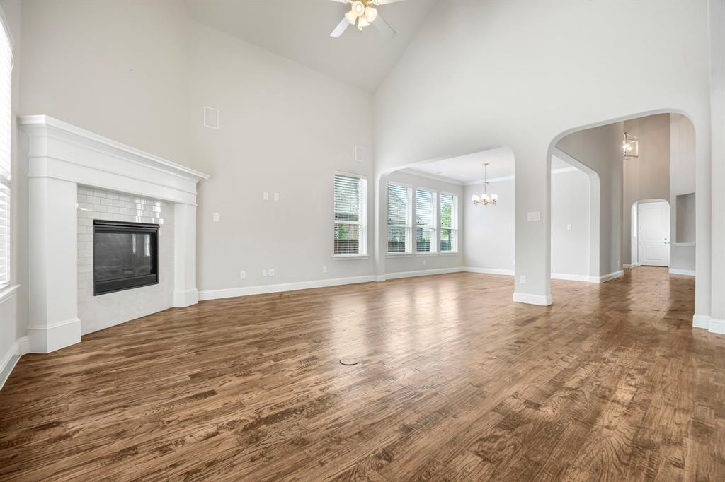 1506 Mariners Hope Way Wylie, TX 75098 - Photo 11 of 39 a view of an empty room with window and wooden floor