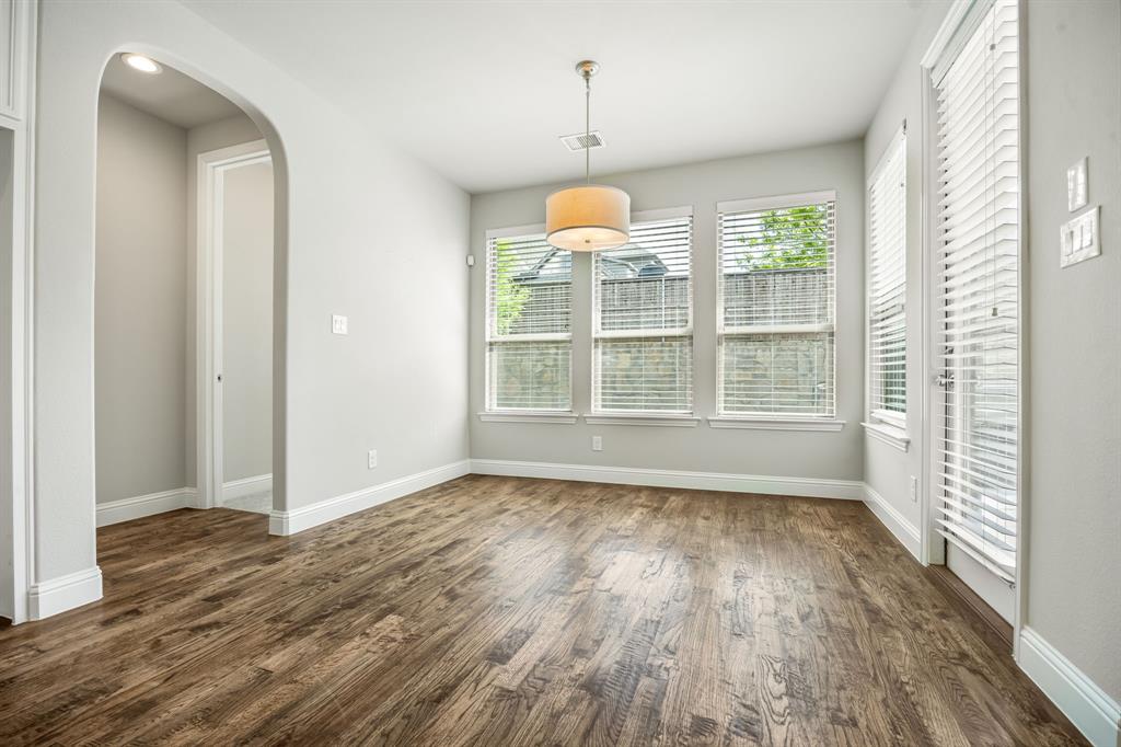 1506 Mariners Hope Way Wylie, TX 75098 - Photo 15 of 39 wooden floor in an empty room with a window