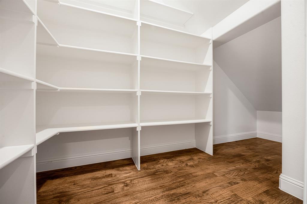 1506 Mariners Hope Way Wylie, TX 75098 - Photo 16 of 39 a view of an empty room with wooden floor