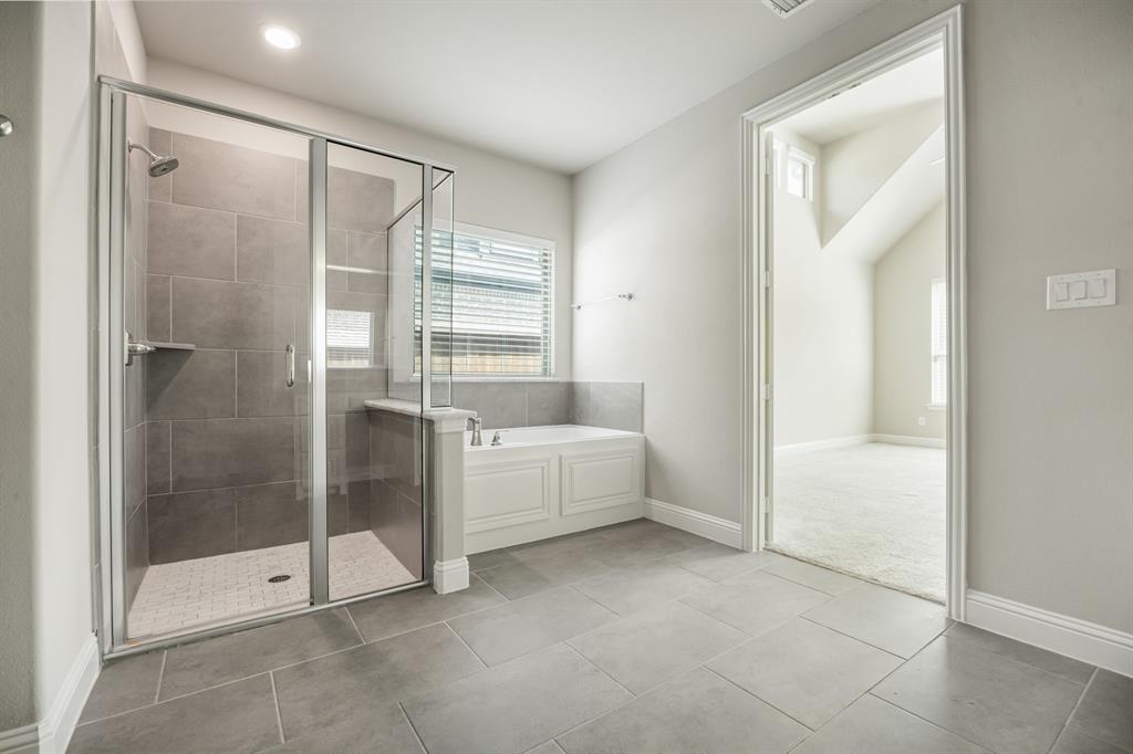 1506 Mariners Hope Way Wylie, TX 75098 - Photo 20 of 39 a bathroom with a tub shower and sink