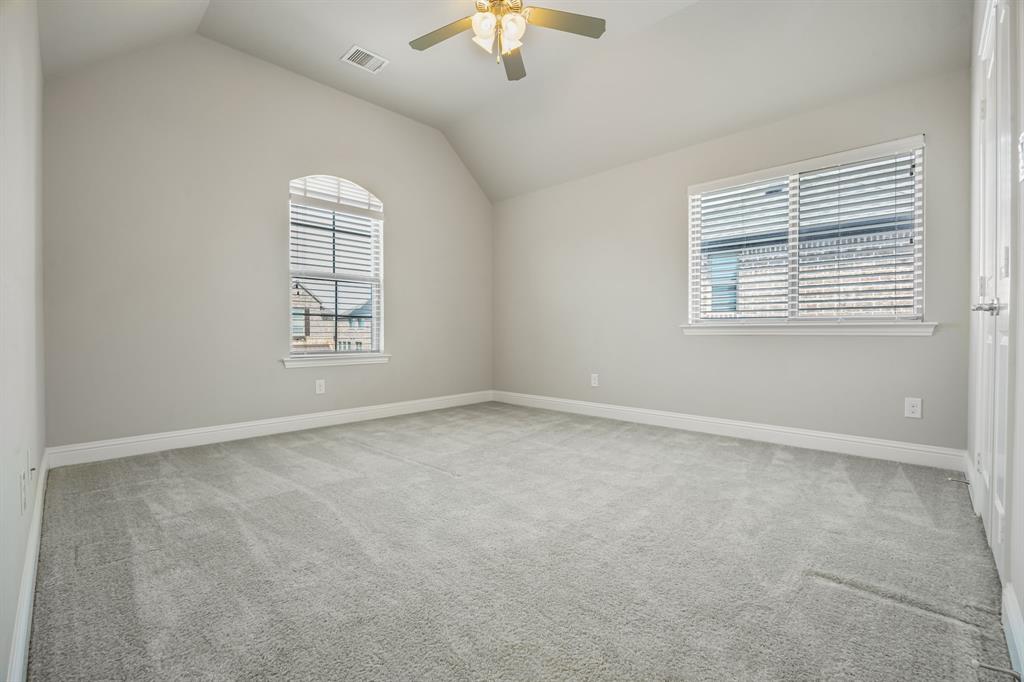 1506 Mariners Hope Way Wylie, TX 75098 - Photo 27 of 39 an empty room with windows and chandelier fan
