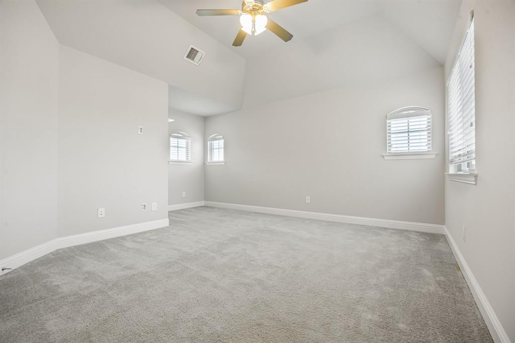 1506 Mariners Hope Way Wylie, TX 75098 - Photo 29 of 39 an empty room with a window and a ceiling fan