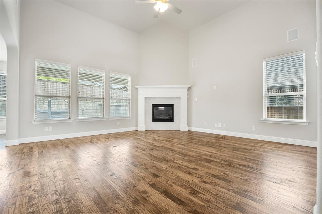 1506 Mariners Hope Way Wylie, TX 75098 - Photo 30 of 39 a view of an empty room with wooden floor and a window