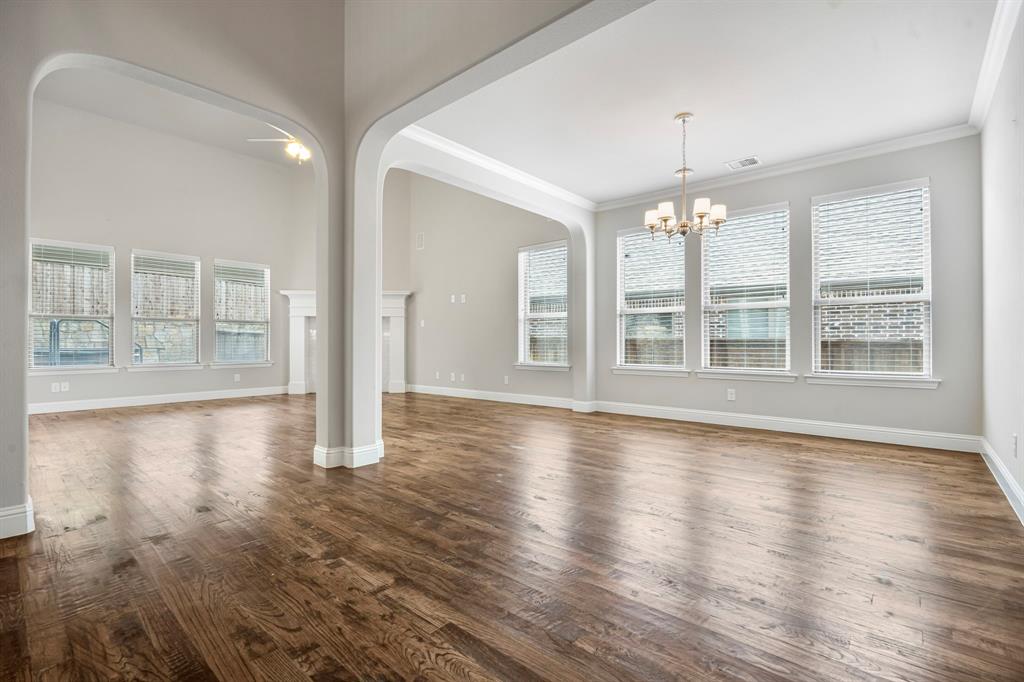1506 Mariners Hope Way Wylie, TX 75098 - Photo 8 of 39 a view of an empty room with window and wooden floor