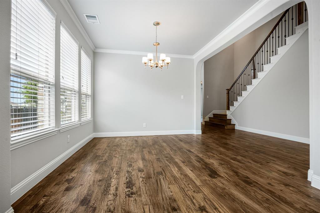 1506 Mariners Hope Way Wylie, TX 75098 - Photo 9 of 39 a view of empty room with wooden floor and fan