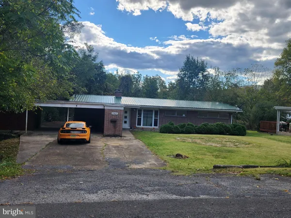 a car parked in front of a house