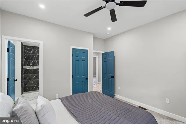 a bedroom with a bed and painted walls