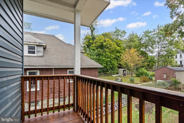 a view of a houses from a balcony