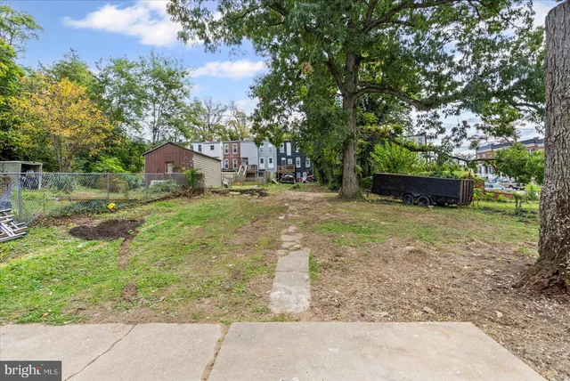 a backyard of a house with lots of green space