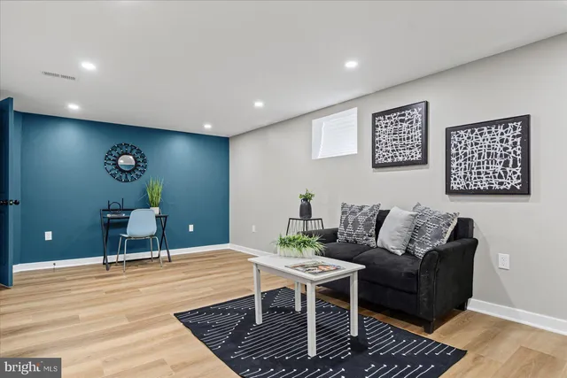 a living room with furniture and a rug