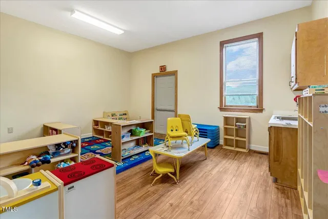 a living room with lots of baby toys