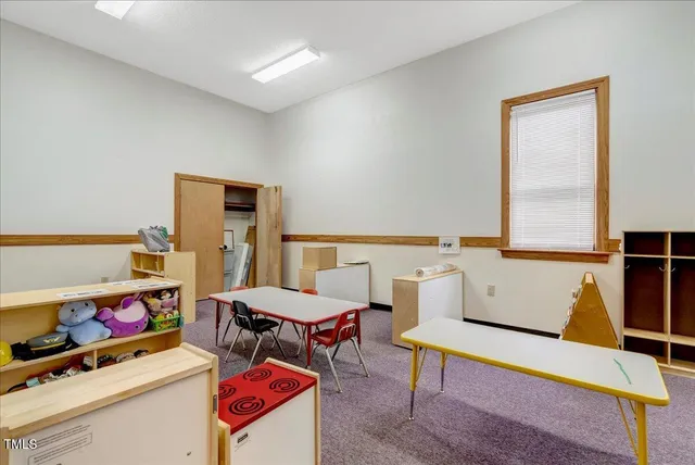 a bed room with a bed and a desk