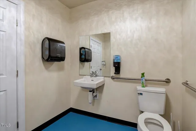 an aerial view of residential houses with outdoor space and pool