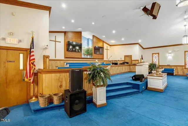 a living room with furniture pool table and a fireplace