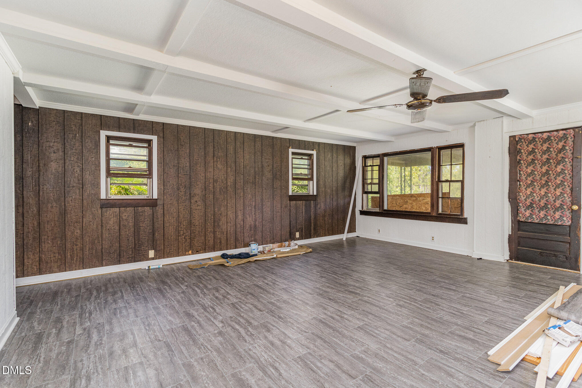 495 Horseshoe Road Aberdeen, NC 28315 - Photo 5 of 16 an empty room with wooden floor and windows