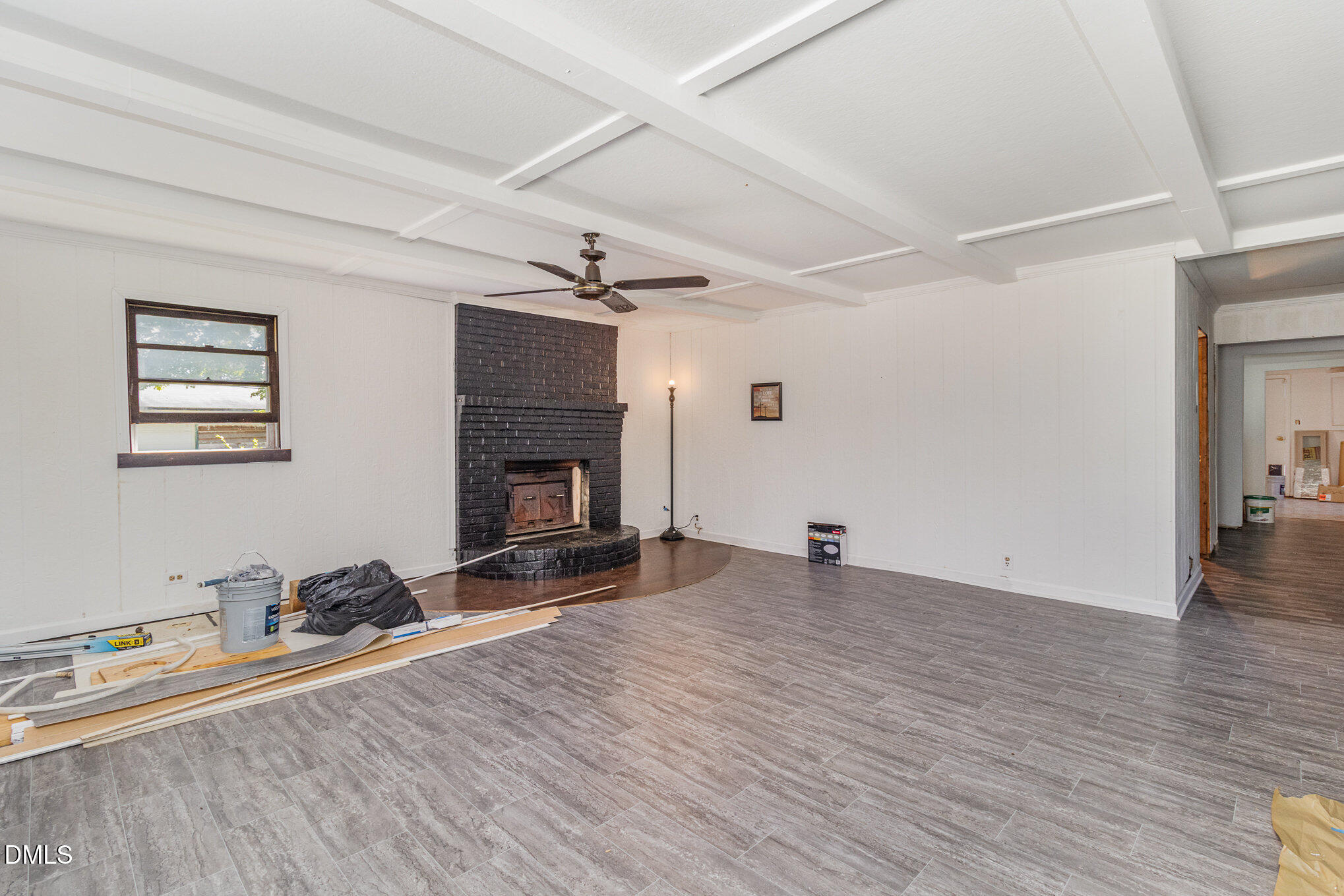 495 Horseshoe Road Aberdeen, NC 28315 - Photo 6 of 16 a view of empty room with wooden floor and fireplace
