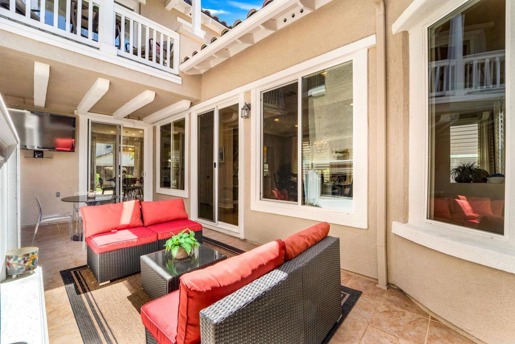 871 First Light Road San Marcos, CA 92078 - Photo 13 of 45 a view of a patio with couches chairs and potted plants