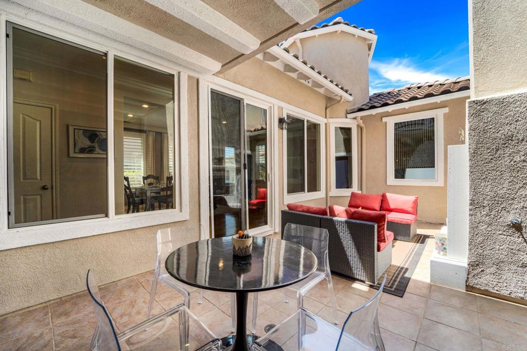 871 First Light Road San Marcos, CA 92078 - Photo 15 of 45 a view of a patio with table and chairs potted plants