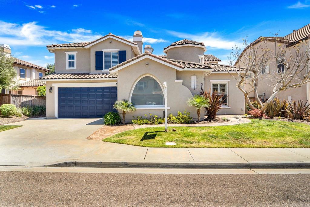 871 First Light Road San Marcos, CA 92078 - Photo 21 of 45 a front view of a house with a yard and garage