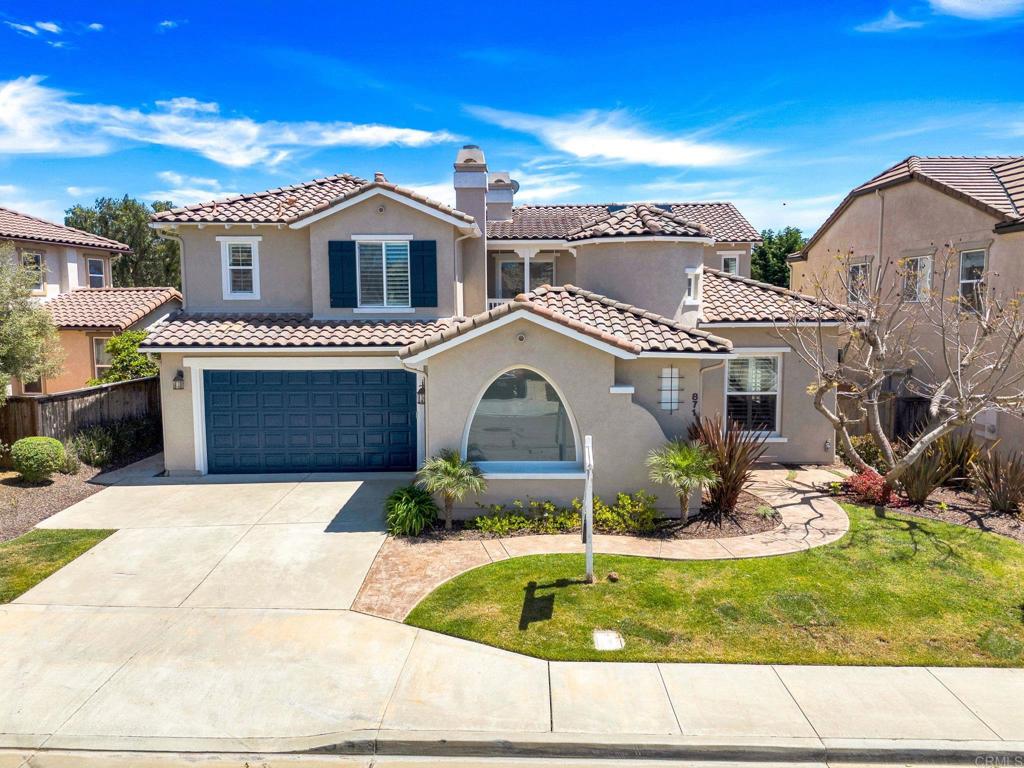 871 First Light Road San Marcos, CA 92078 - Photo 22 of 45 a front view of a house with garden