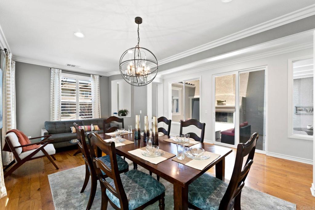 871 First Light Road San Marcos, CA 92078 - Photo 23 of 45 a view of a dining room with furniture window and wooden floor