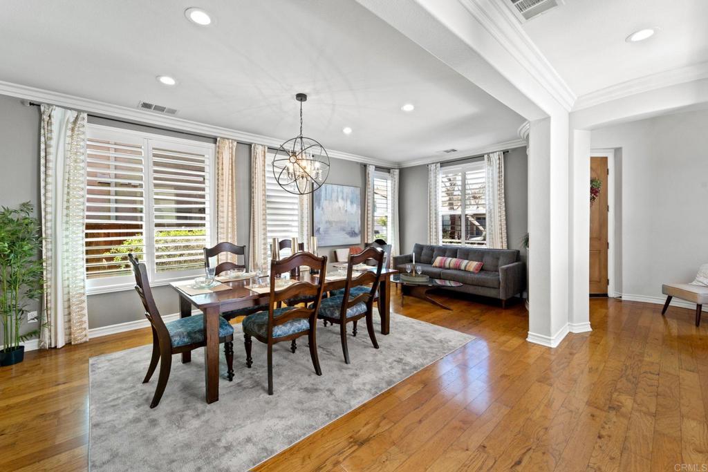 871 First Light Road San Marcos, CA 92078 - Photo 24 of 45 a view of a dining room with furniture and wooden floor