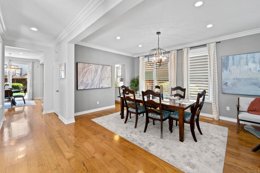 871 First Light Road San Marcos, CA 92078 - Photo 25 of 45 a view of a a dining room with furniture window and wooden floor