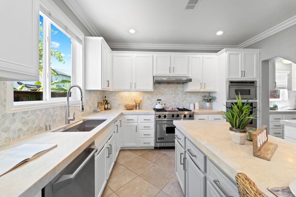 871 First Light Road San Marcos, CA 92078 - Photo 32 of 45 a kitchen with a sink stove top oven and refrigerator