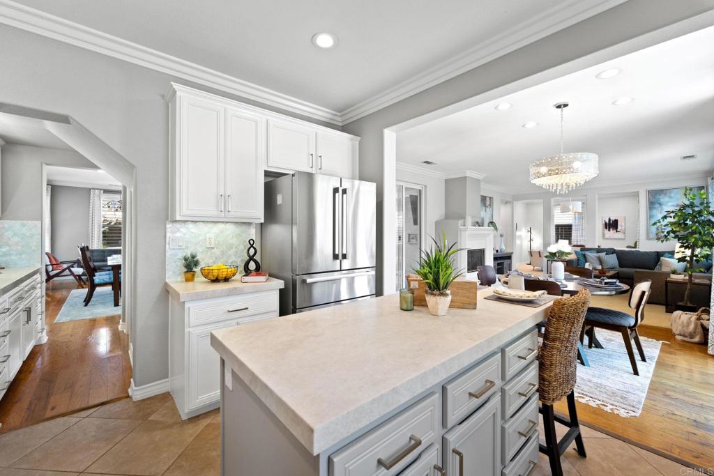 871 First Light Road San Marcos, CA 92078 - Photo 36 of 45 a view of a dining table and chairs in a kitchen