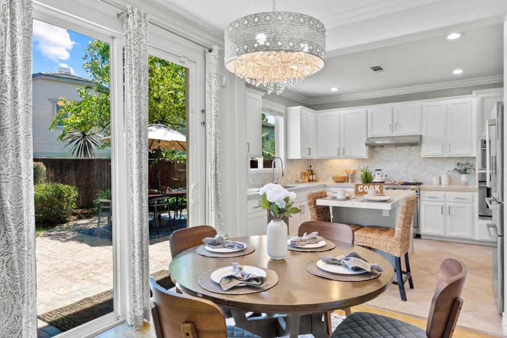 871 First Light Road San Marcos, CA 92078 - Photo 45 of 45 a view of a dining room with furniture a livingroom and chandelier