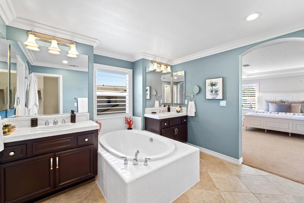 871 First Light Road San Marcos, CA 92078 - Photo 5 of 45 a spacious bathroom with a tub sink and mirror