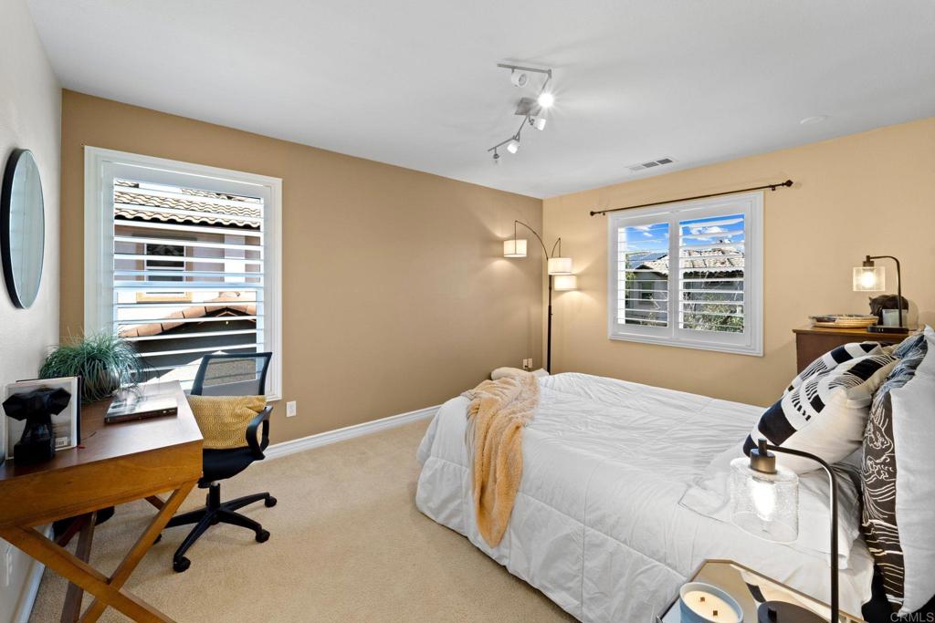 871 First Light Road San Marcos, CA 92078 - Photo 6 of 45 a bedroom with furniture and a window