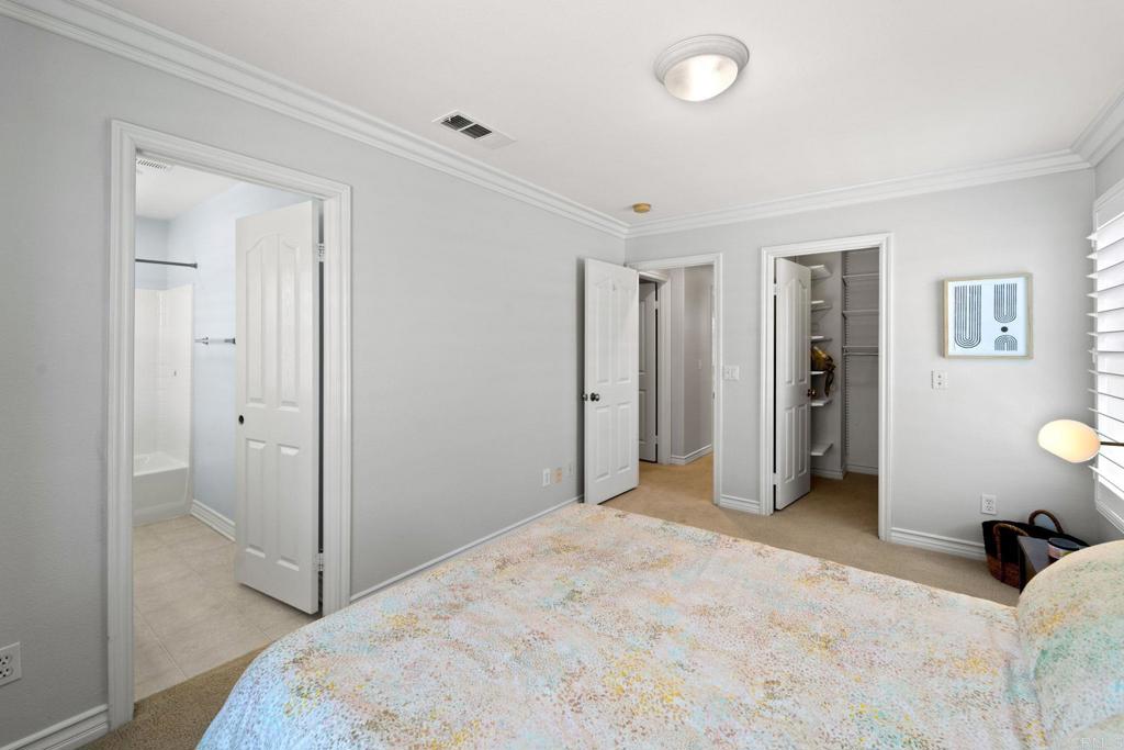871 First Light Road San Marcos, CA 92078 - Photo 8 of 45 a bedroom with a bed and a bathroom