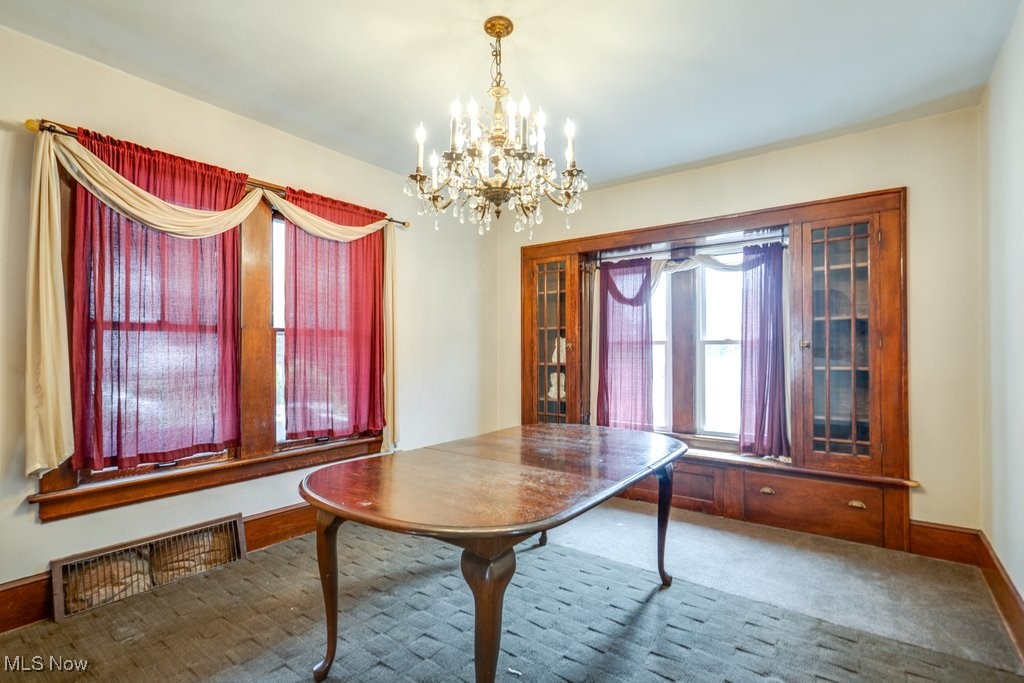 516 Floyd Street Akron, OH 44310 - Photo 8 of 50 Dining space featuring a chandelier and carpet floors