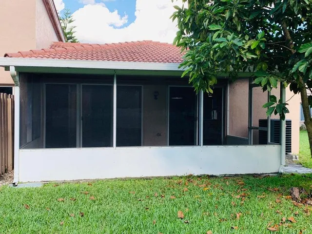 a front view of a house with yard