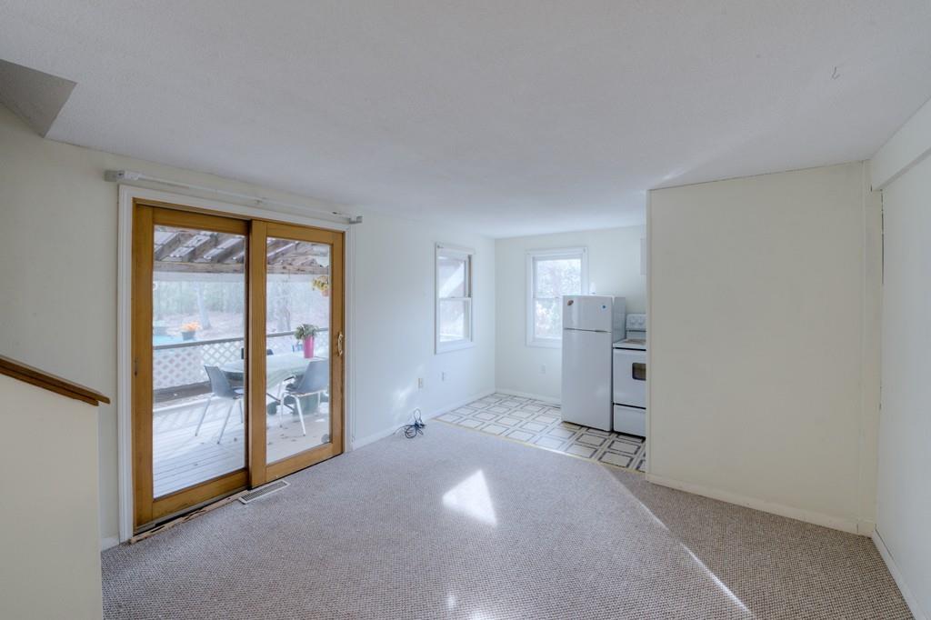 39 Bennett Road Wilbraham, MA 01095 - Photo 12 of 24 an empty room with windows and entrance