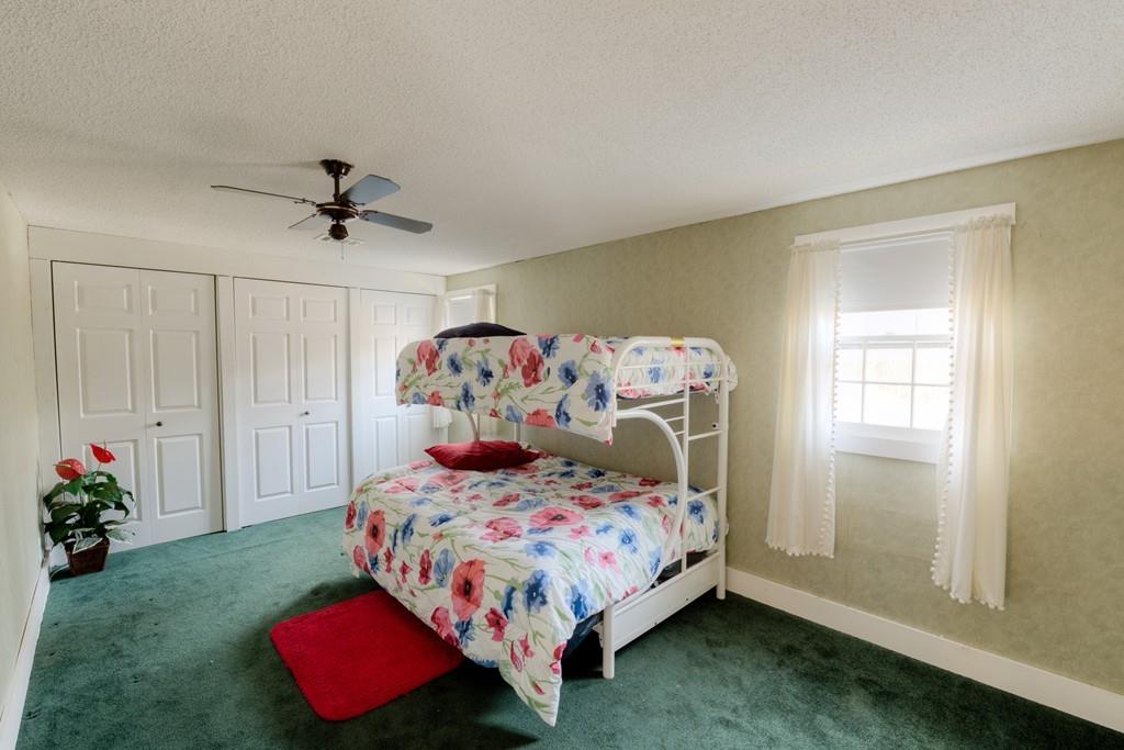 39 Bennett Road Wilbraham, MA 01095 - Photo 13 of 24 a bedroom with a bed and a window