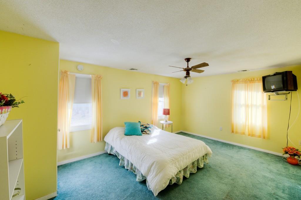 39 Bennett Road Wilbraham, MA 01095 - Photo 17 of 24 a bedroom with a bed and ceiling fan
