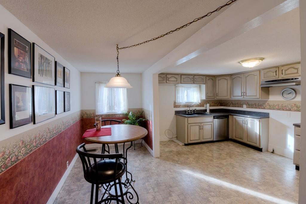 39 Bennett Road Wilbraham, MA 01095 - Photo 2 of 24 a kitchen with granite countertop a sink cabinets and stainless steel appliances