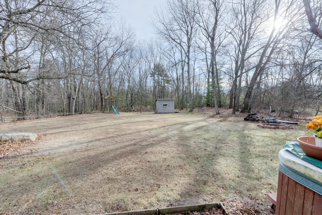 39 Bennett Road Wilbraham, MA 01095 - Photo 22 of 24 a backyard of a house with trees