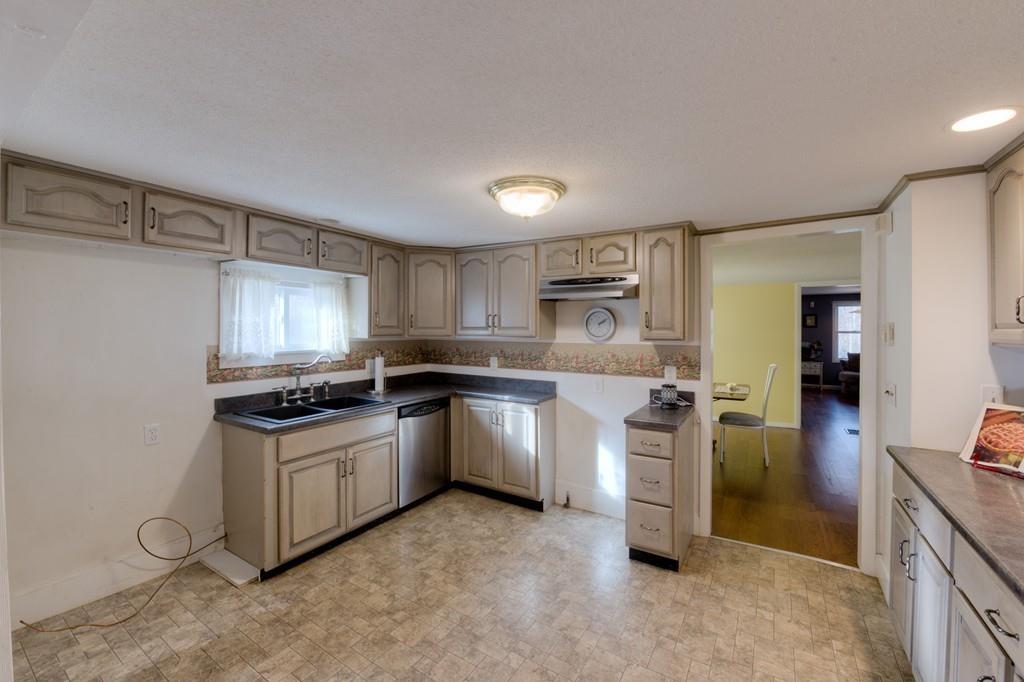 39 Bennett Road Wilbraham, MA 01095 - Photo 3 of 24 a kitchen with stainless steel appliances granite countertop a stove a sink and a refrigerator