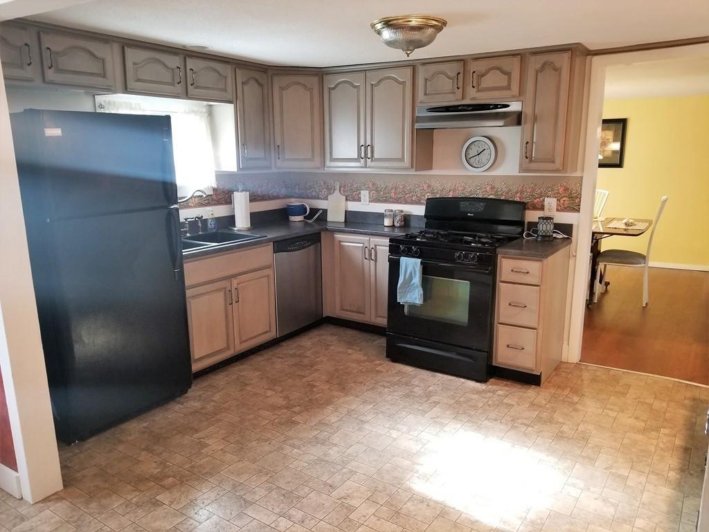 39 Bennett Road Wilbraham, MA 01095 - Photo 5 of 24 a kitchen with stainless steel appliances granite countertop a stove a sink and a refrigerator