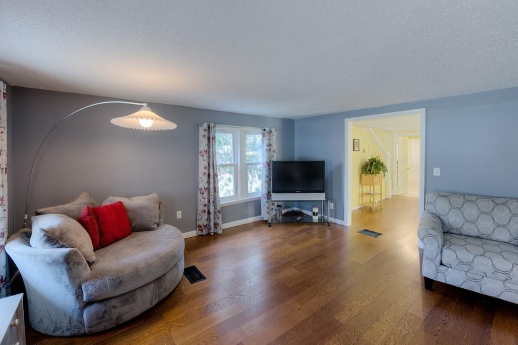 39 Bennett Road Wilbraham, MA 01095 - Photo 6 of 24 a living room with furniture and a flat screen tv
