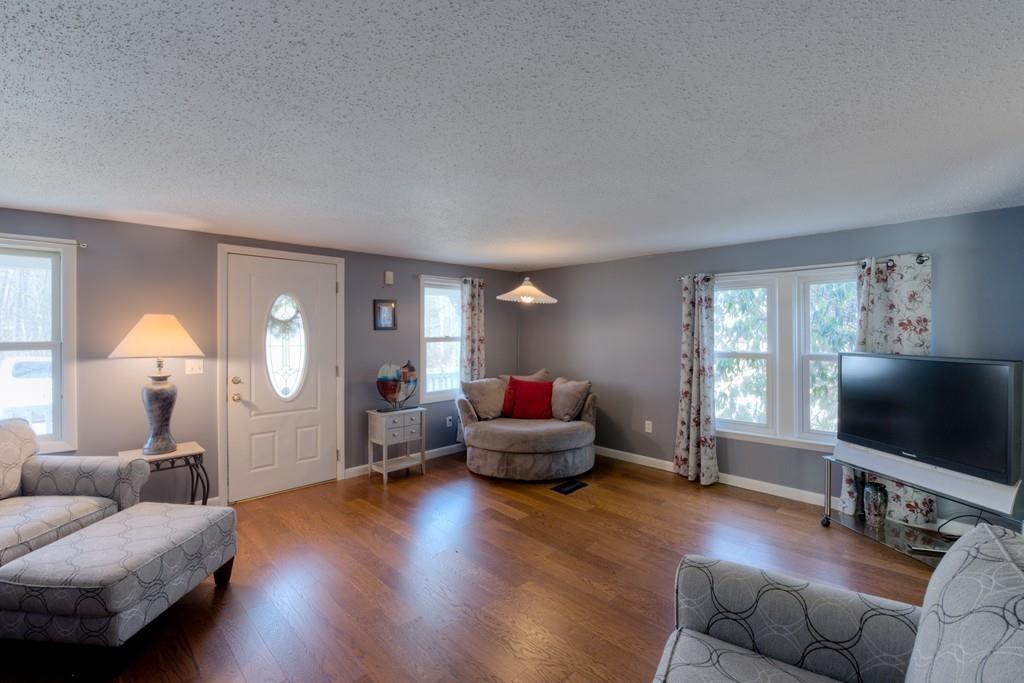 39 Bennett Road Wilbraham, MA 01095 - Photo 7 of 24 a living room with furniture and a flat screen tv