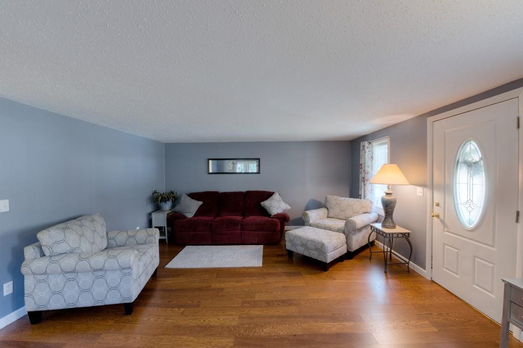 39 Bennett Road Wilbraham, MA 01095 - Photo 8 of 24 a living room with furniture and a mirror