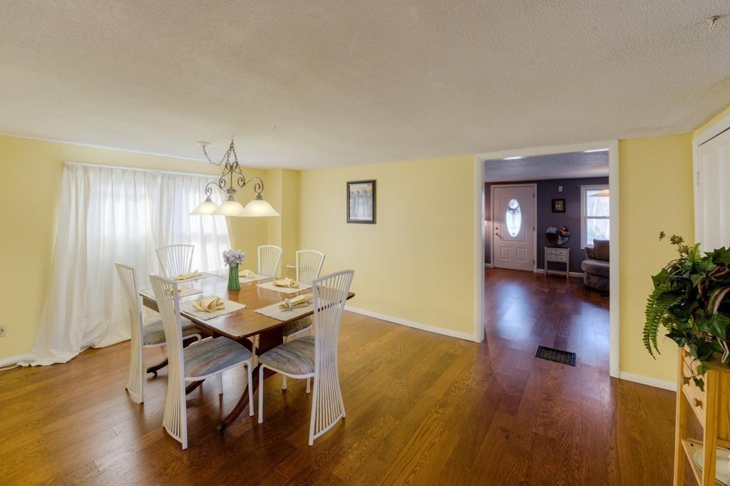 39 Bennett Road Wilbraham, MA 01095 - Photo 9 of 24 a view of a dining room with furniture and wooden floor