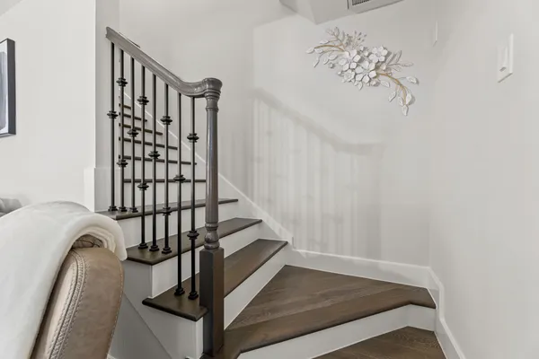 a view of staircase with white walls