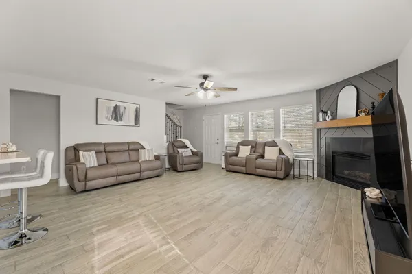 a living room with furniture and a fireplace