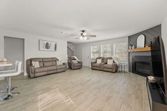 a living room with furniture and a fireplace